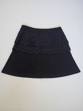 Cabi Soirée Black A-Line skirt featuring a layered lace overlay & a side zipper